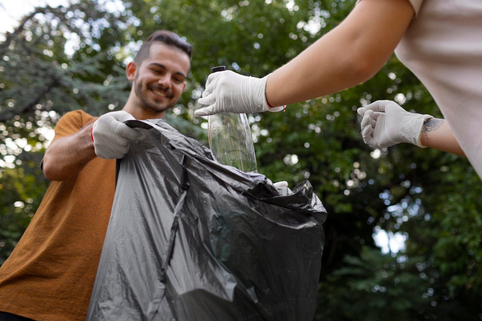 people cleaning garbage from nature scaled