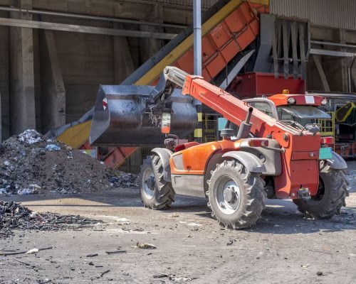 loader-transporting-soil-waste-materials-waste-treatment-plant_181624-47747